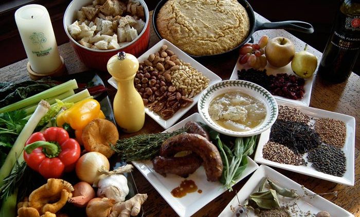Ingredients for delicious stuffing, such as spices, herbs, onions, vegetables and bread.