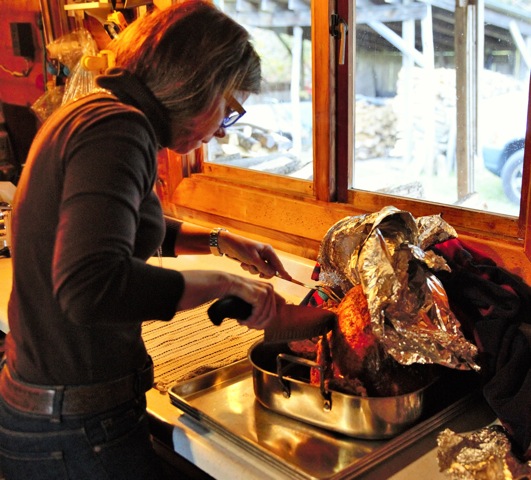 Chef Nancy Henley carves Thanksgiving turkey at the family maple syrup farm.