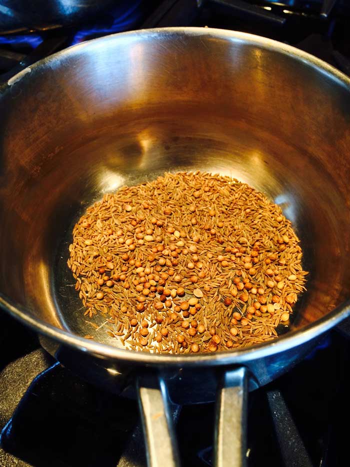Close-up view of dry roasting spices. Learn how to do this yourself in my Herby and Spicy Chicken Burgers System.
